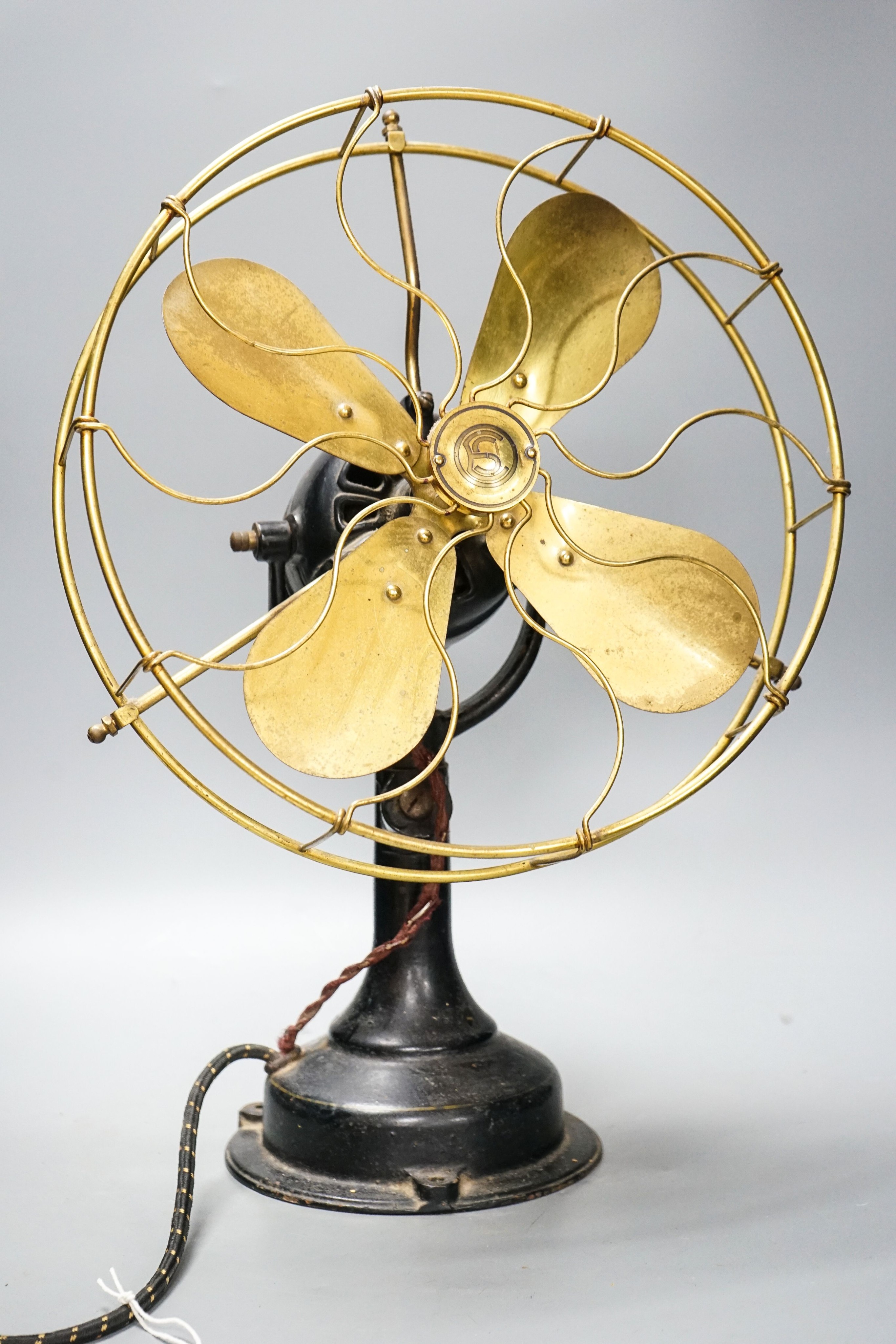 A vintage electric oscillating fan